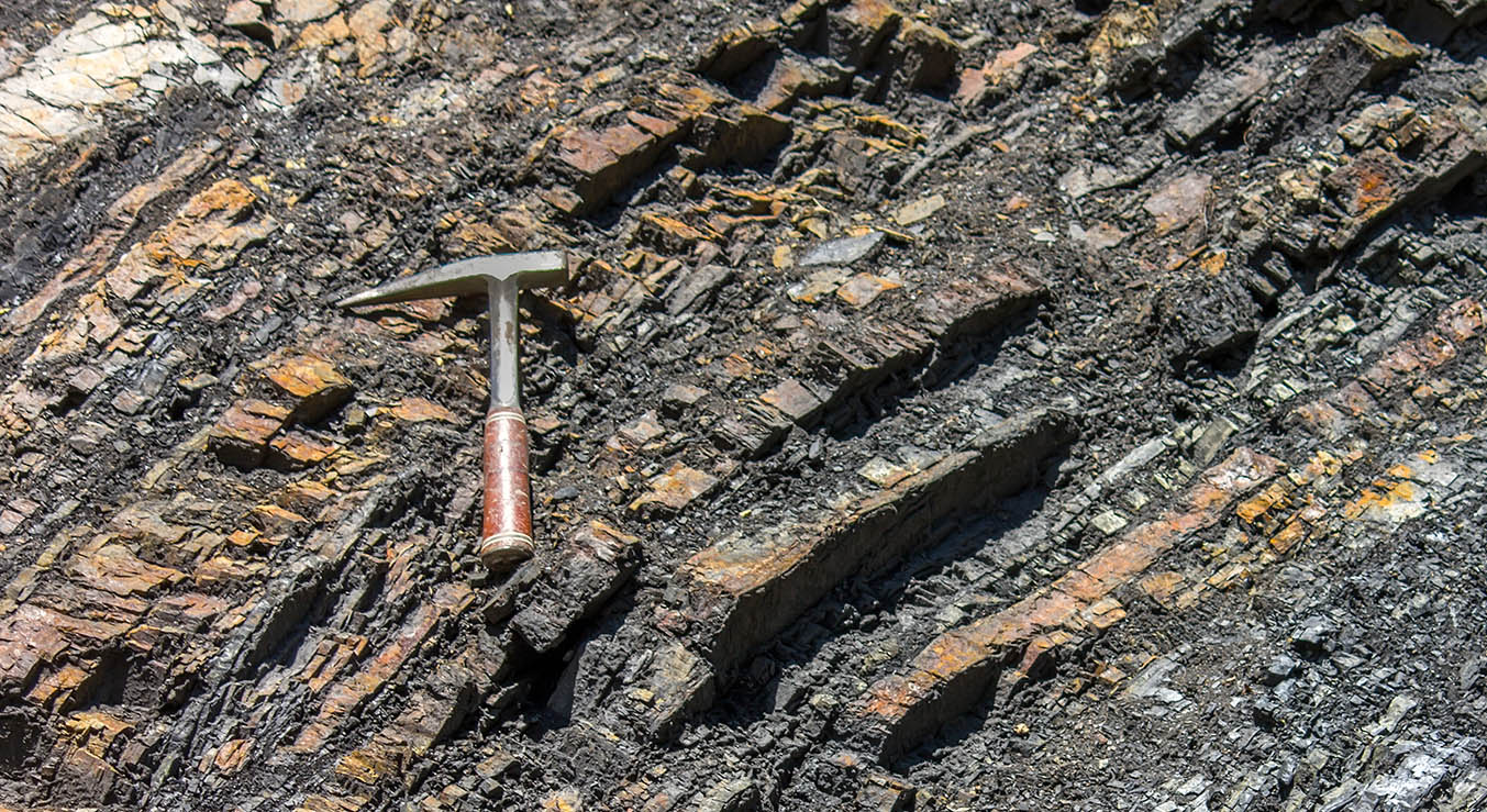 Geological hammer on the rocks